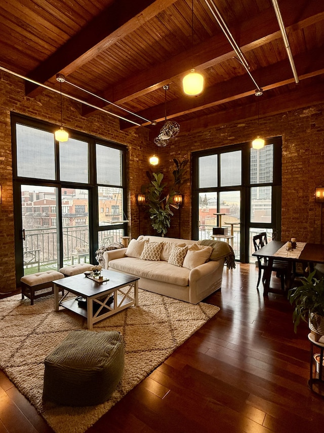 living room with wood ceiling, brick wall, beamed ceiling, and hardwood / wood-style flooring