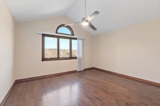 unfurnished room with ceiling fan, vaulted ceiling, baseboards, and dark wood finished floors