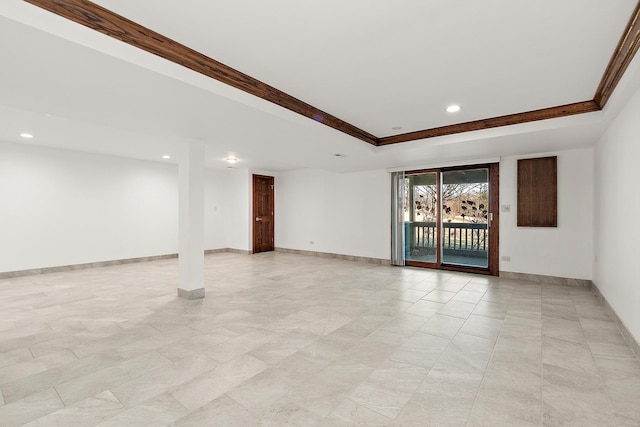 empty room with crown molding, a tray ceiling, recessed lighting, and baseboards