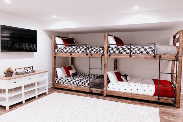 bedroom featuring wood finished floors and recessed lighting