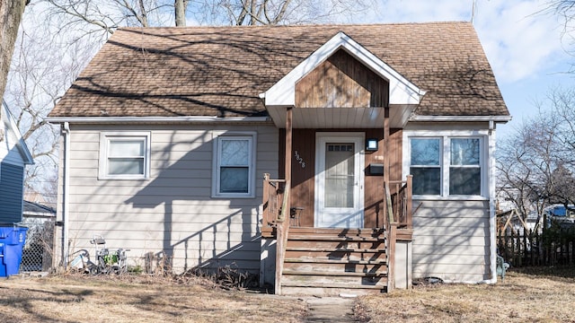 view of front of house featuring entry steps and a shingled roof