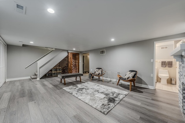 interior space with baseboards, visible vents, wood finished floors, and recessed lighting