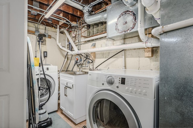 laundry room with cabinet space and washer and dryer