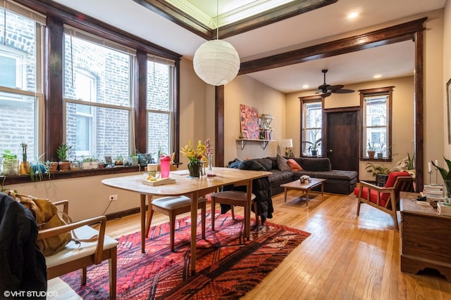 dining space featuring light wood-style floors and a ceiling fan