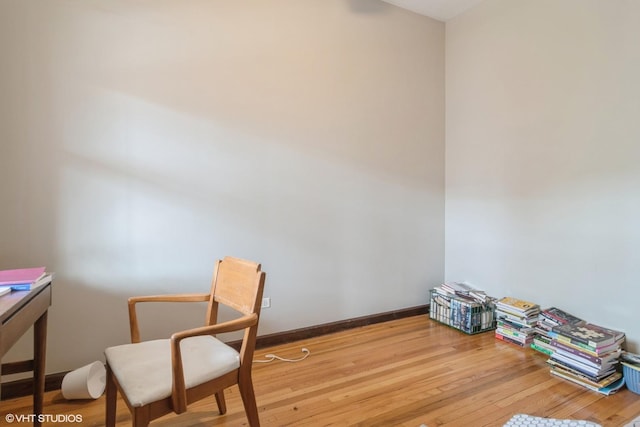 interior space with wood-type flooring and baseboards