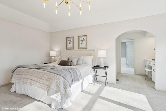 bedroom with arched walkways, light colored carpet, a notable chandelier, and baseboards