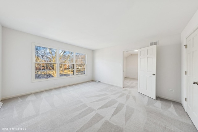 unfurnished bedroom with light carpet, baseboards, and visible vents