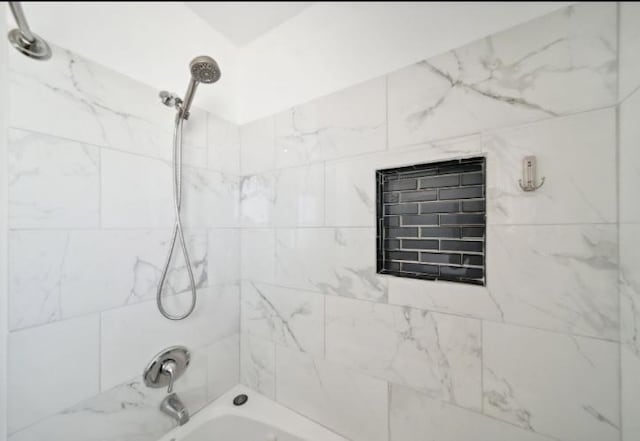 bathroom featuring washtub / shower combination