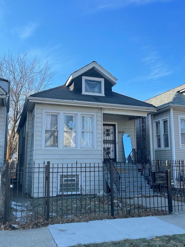 bungalow-style house with a fenced front yard