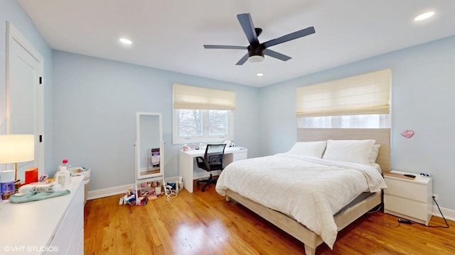 bedroom featuring light wood finished floors, baseboards, and recessed lighting