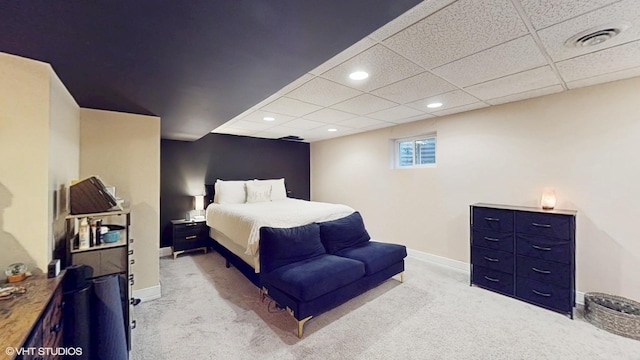 bedroom featuring visible vents, baseboards, light colored carpet, a paneled ceiling, and recessed lighting