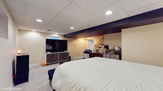 bedroom with carpet floors, recessed lighting, a paneled ceiling, and baseboards