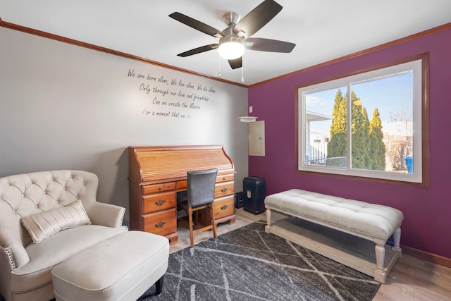 home office featuring baseboards, ceiling fan, wood finished floors, and crown molding