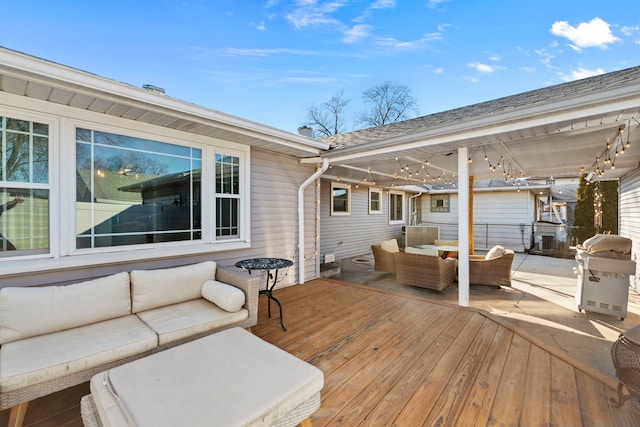 deck with an outdoor living space and grilling area