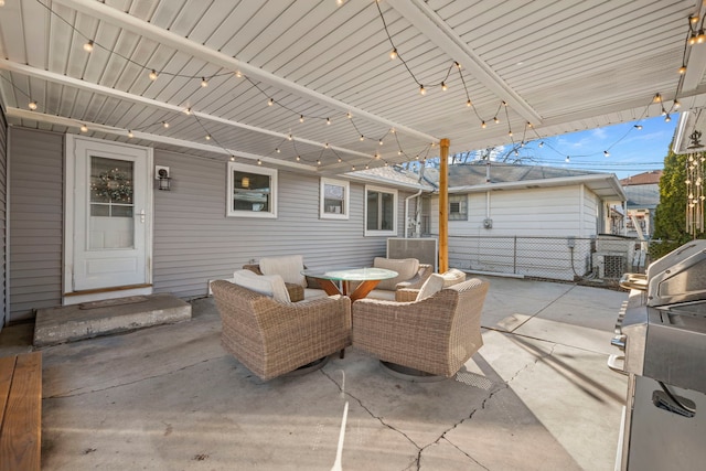 view of patio featuring fence and an outdoor hangout area