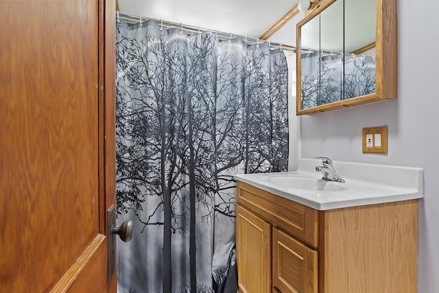 full bath with a shower with shower curtain and vanity