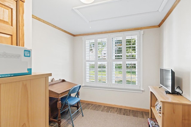 office featuring a wealth of natural light, attic access, and crown molding