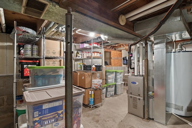 storage featuring visible vents and gas water heater