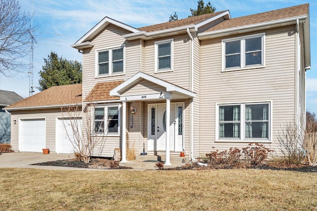 traditional-style home with a garage, a front yard, driveway, and a shingled roof