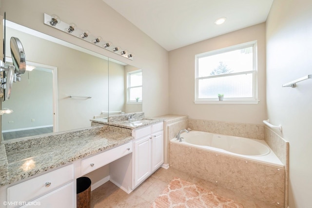 full bath featuring tile patterned flooring, vanity, and a bath