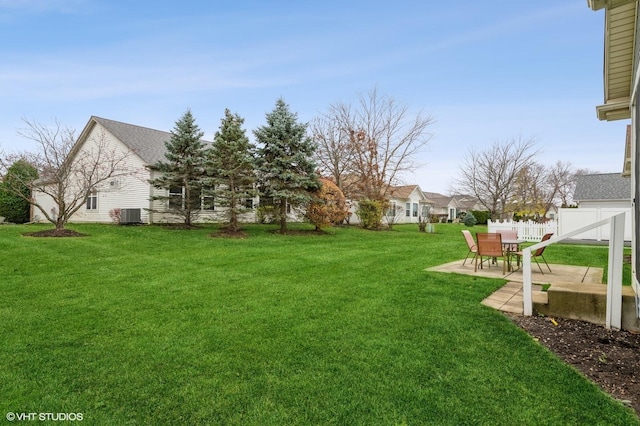 view of yard with central AC unit, a patio area, and fence