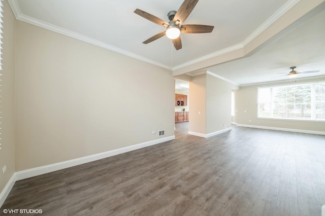 unfurnished room with baseboards, visible vents, a ceiling fan, ornamental molding, and wood finished floors