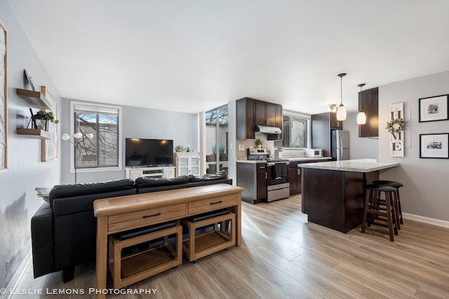 living room featuring light wood-style floors and baseboards