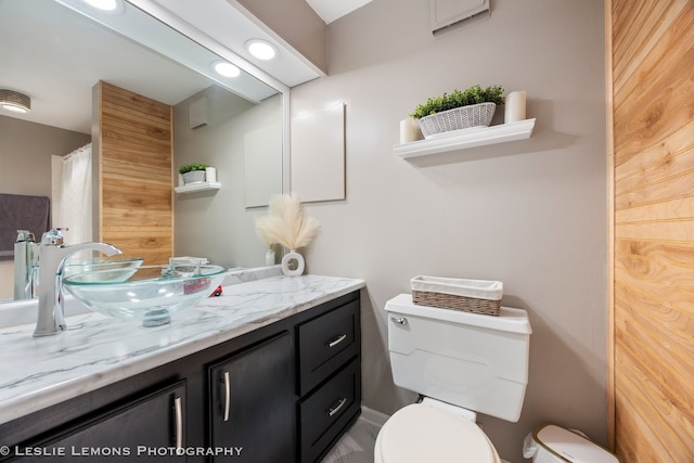 bathroom with vanity and toilet