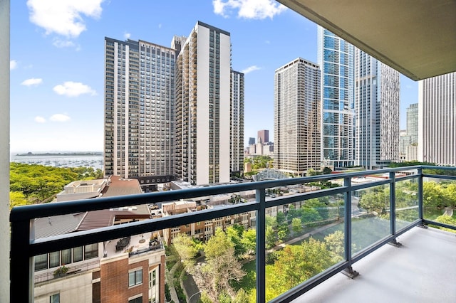 balcony with a view of city and a water view