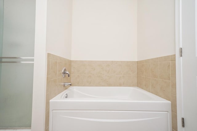 full bathroom with a garden tub