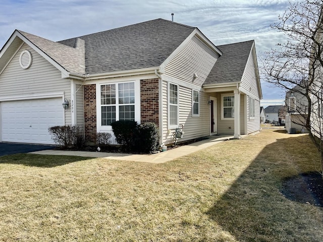 view of property exterior with a yard, brick siding, roof with shingles, and an attached garage