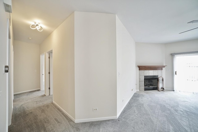 hallway with carpet and baseboards