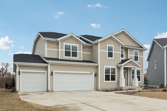 view of front of home with driveway and an attached garage