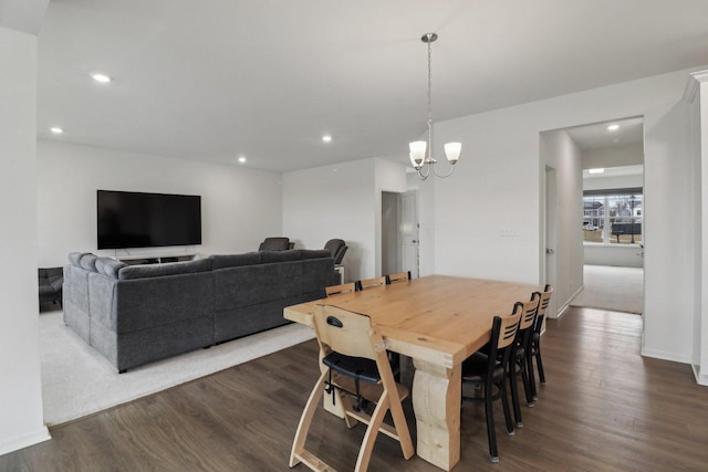 dining area with an inviting chandelier, dark wood finished floors, and recessed lighting