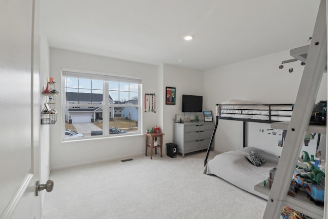 carpeted bedroom with visible vents and recessed lighting