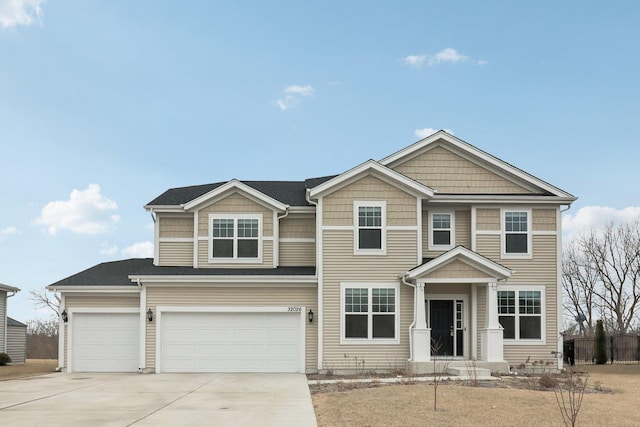 view of front of house with a garage and concrete driveway