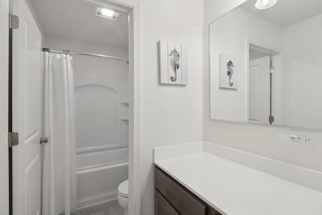 bathroom with vanity, toilet, and shower / bath combo with shower curtain