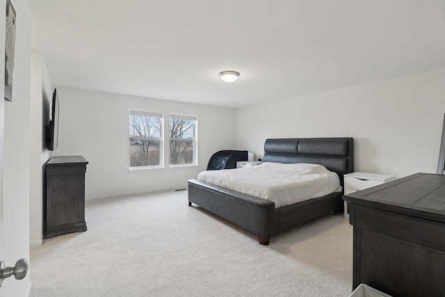 bedroom with light colored carpet