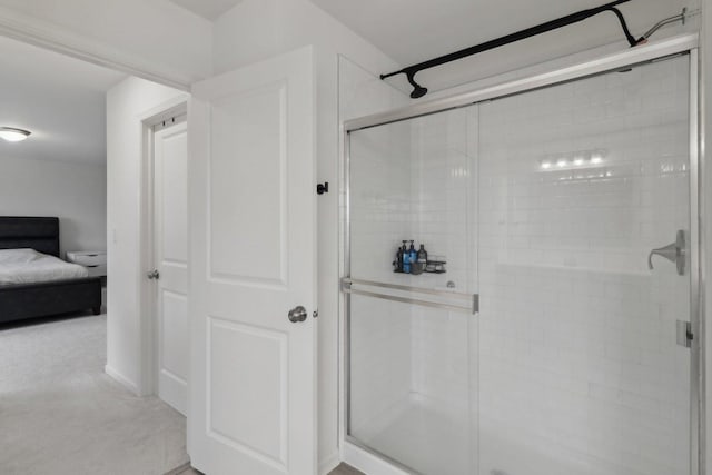 ensuite bathroom with a stall shower and ensuite bath