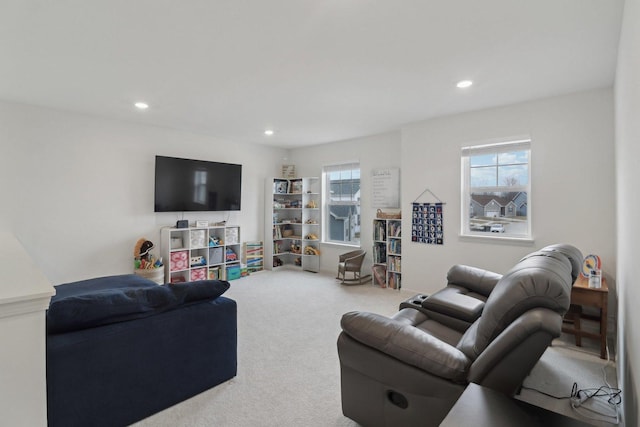 carpeted living room with a healthy amount of sunlight and recessed lighting