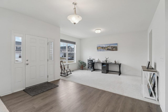 entryway with wood finished floors