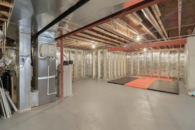 unfinished basement with gas water heater and heating unit