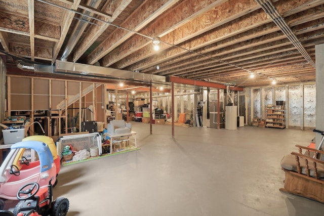 unfinished basement featuring water heater