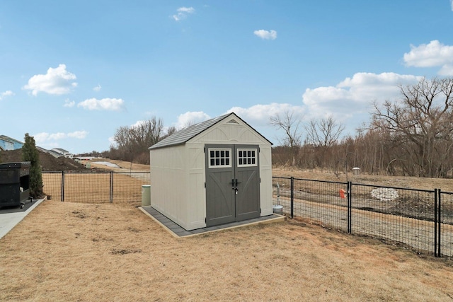 view of shed featuring a fenced backyard