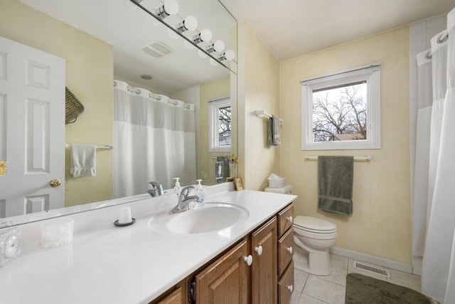 bathroom featuring visible vents, vanity, toilet, and tile patterned floors