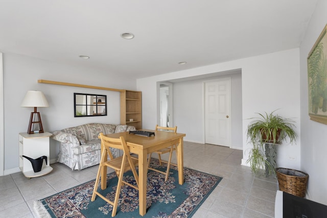 dining room featuring recessed lighting, tile patterned flooring, and baseboards