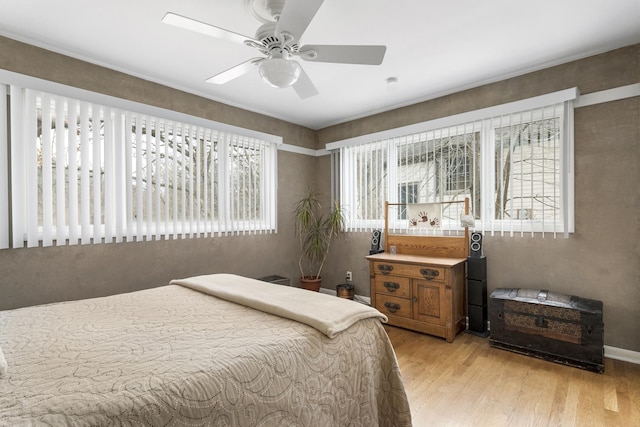 bedroom featuring ceiling fan and light wood-type flooring