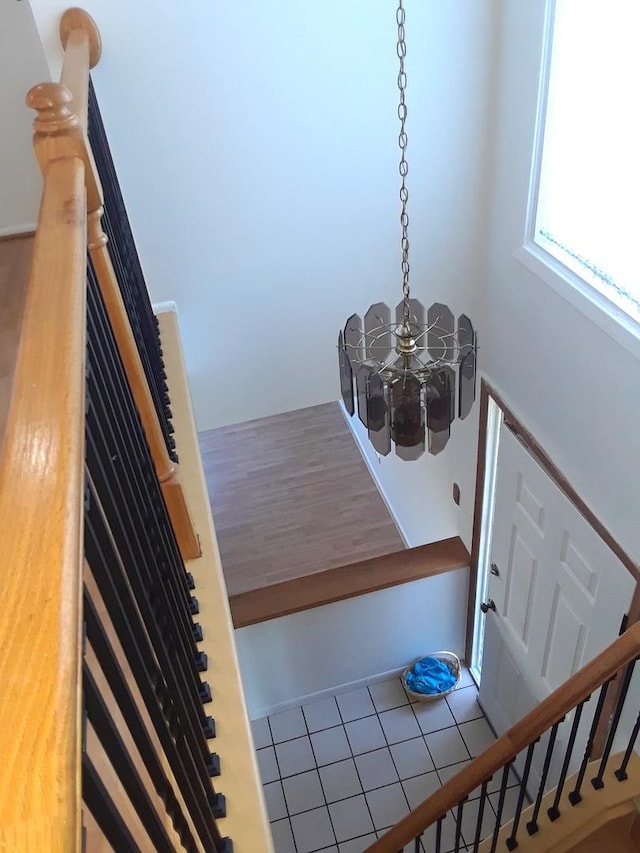 tiled entryway featuring stairs