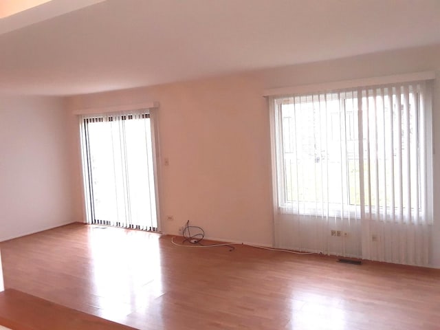 empty room with wood finished floors