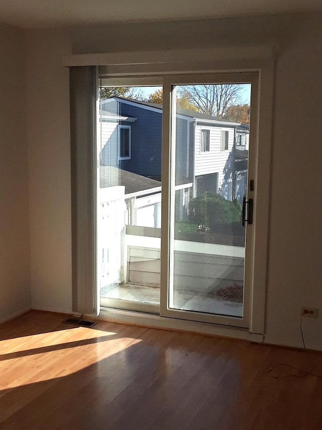 entryway with wood finished floors